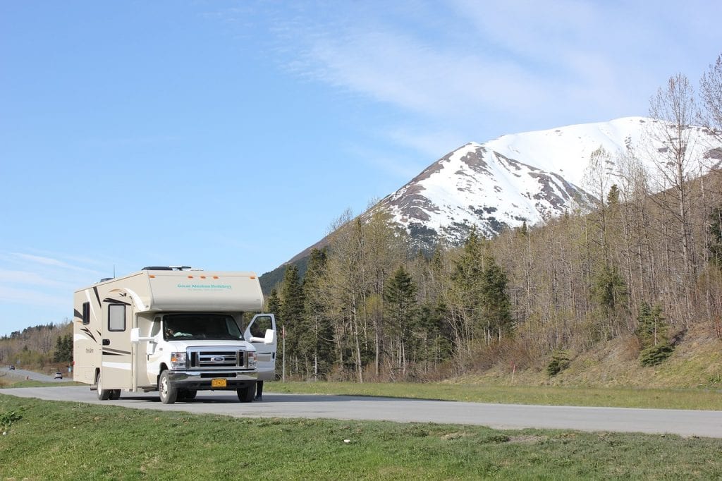 recreational vehicle driving along a mountain
