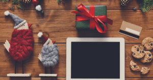 wool birds and christmas gifts with cookies credit card and ipad