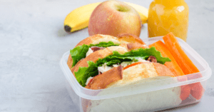 sandwich fruit and juice in a healthy packed lunch