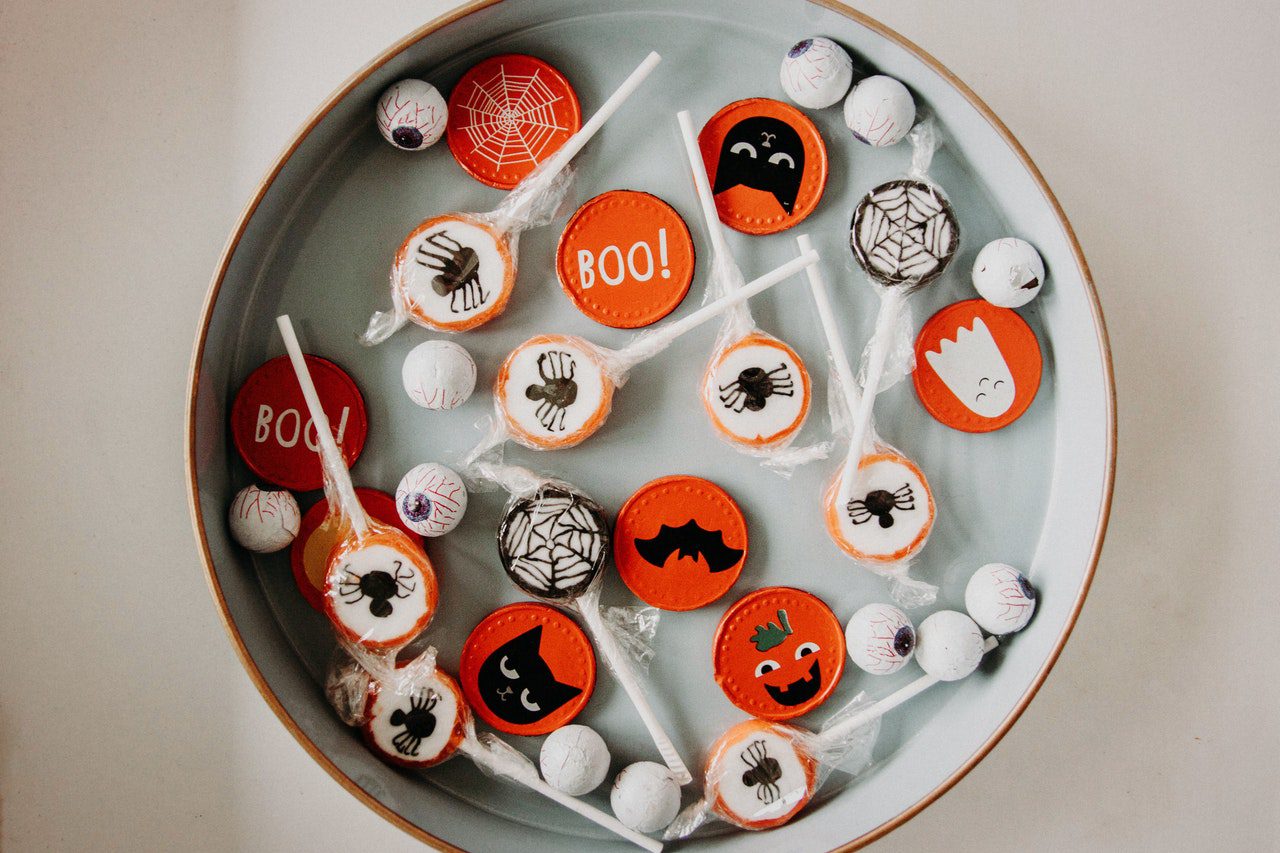 tray of halloween candies and cookies looking festive