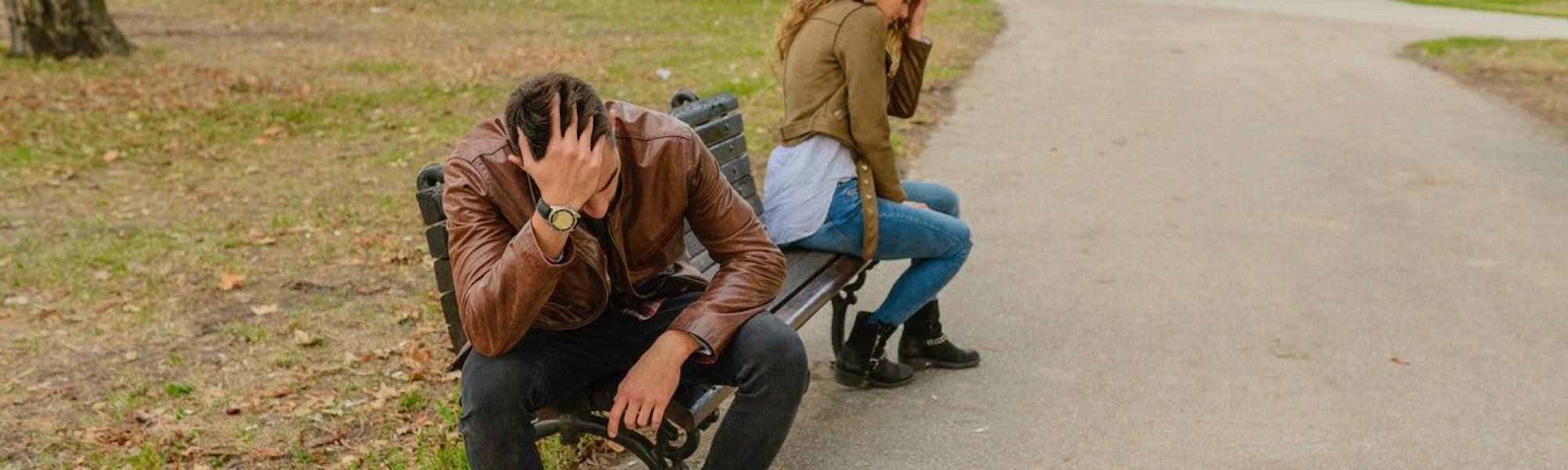 couple on park bench breaking up