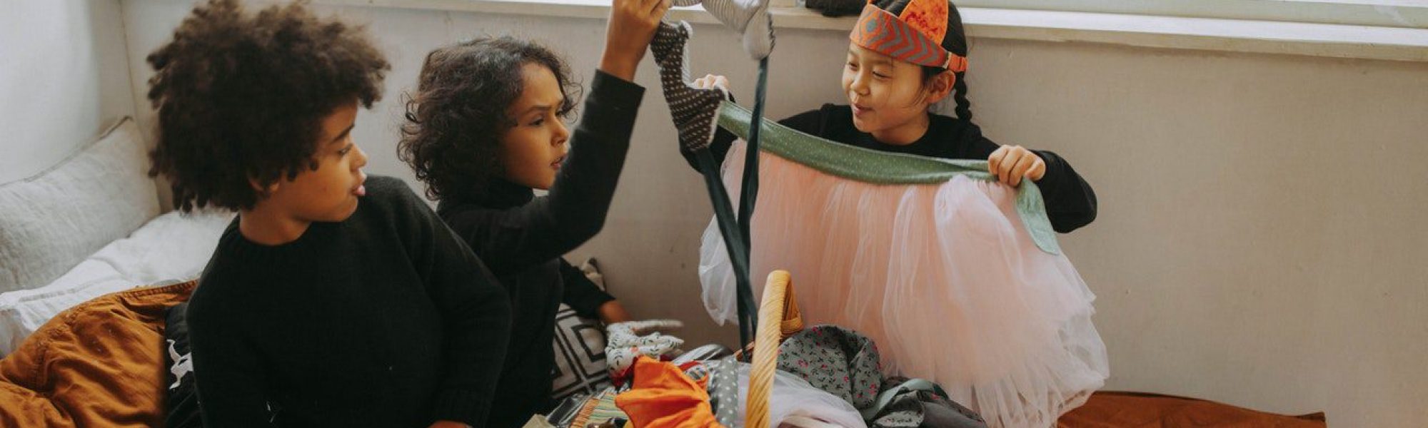 children making costumes in a brightly lit room